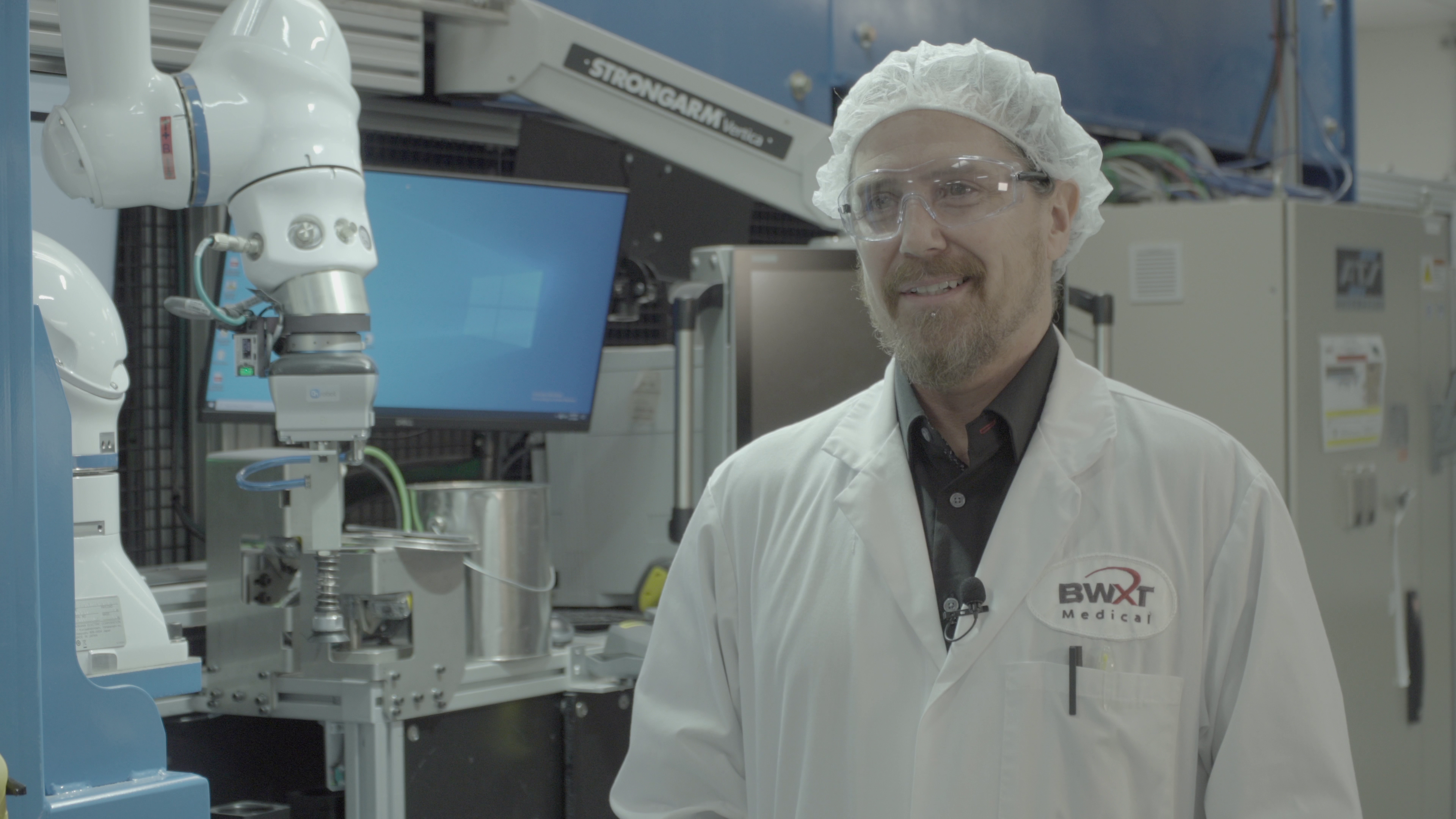 Employee faces camera from BWXT Medical.